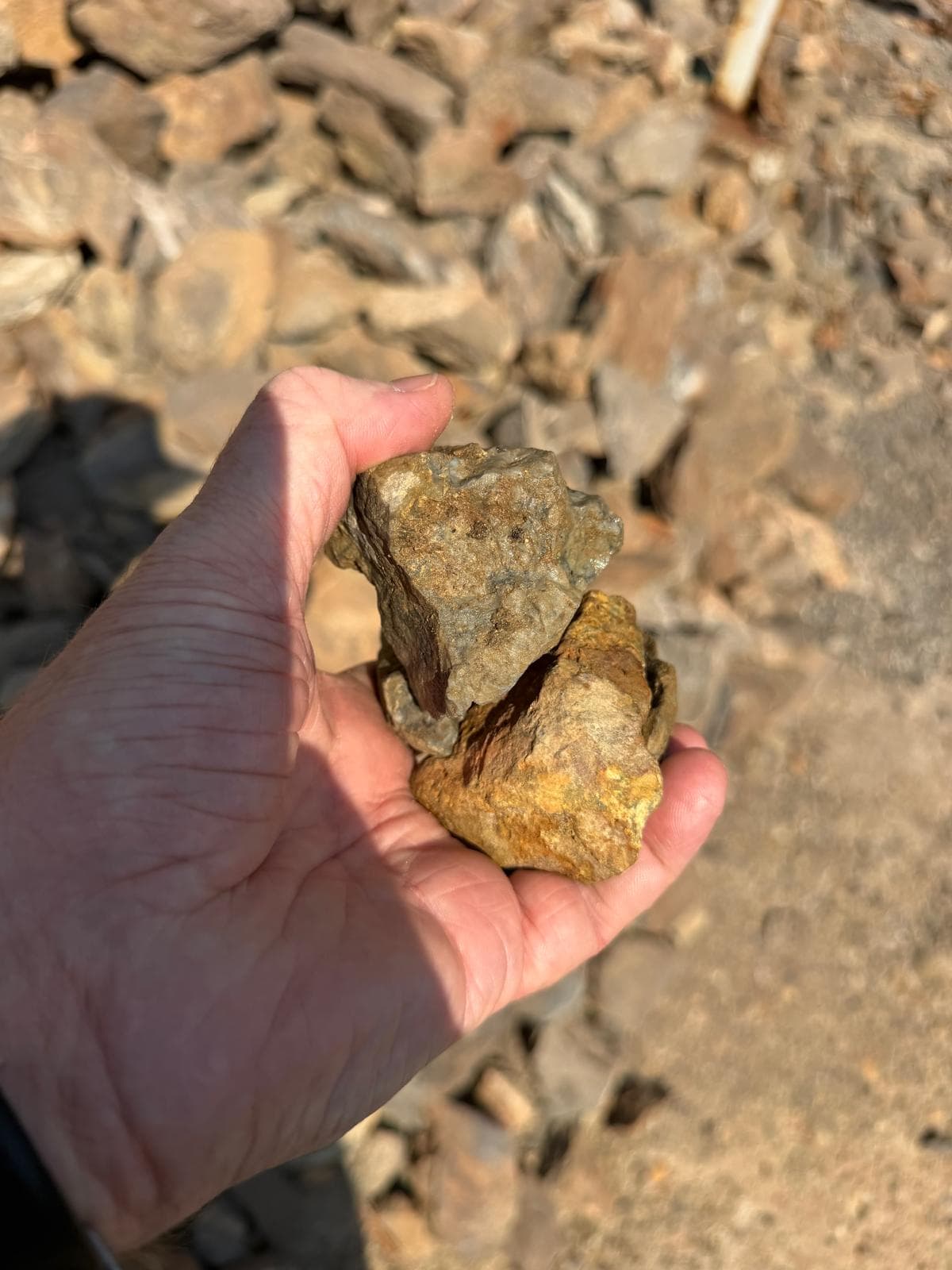 Open-pit mining operation with heavy equipment extracting ore